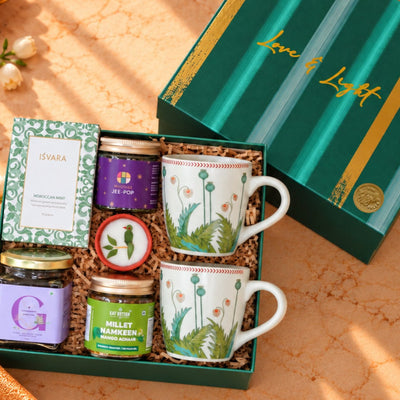 Royale Blossom luxury gift basket with gourmet snacks, floral honey, herbal mint tea and handcrafted festive accessories