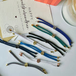 Evil Eye Hamsa Mini Rakhi with Initial | Assorted Thread Colour